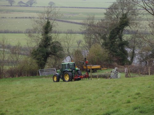 Fence posts are put into place around the apiary.